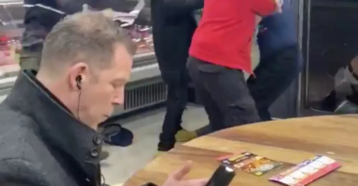 Man Continues To Eat His Chips In The Midst Of A Fight In A Kebab Shop