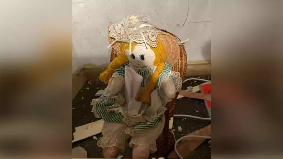 Man finds creepy doll and eerie note inside wall of new home