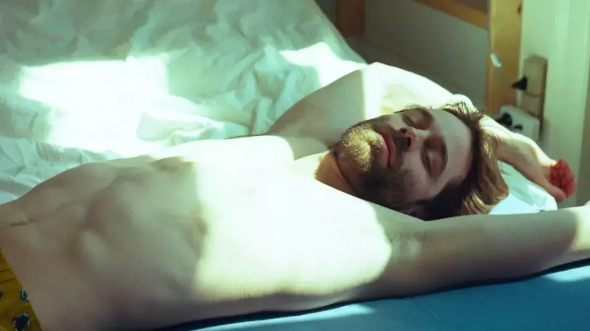 Man lying in bed
