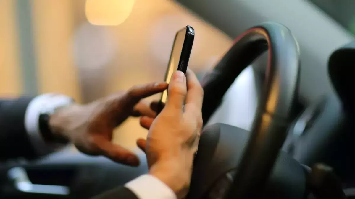 Use of handheld mobile while driving to become illegal next year