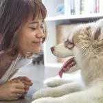 Woman looking at puppy