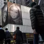 He Hung Pictures Of Himself And His New Wife On A Building To Taunt His Ex