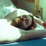 Man lying in bed