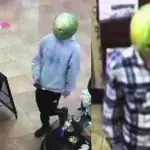 Shoplifters wearing watermelon masks.