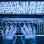 Hacker and his laptop