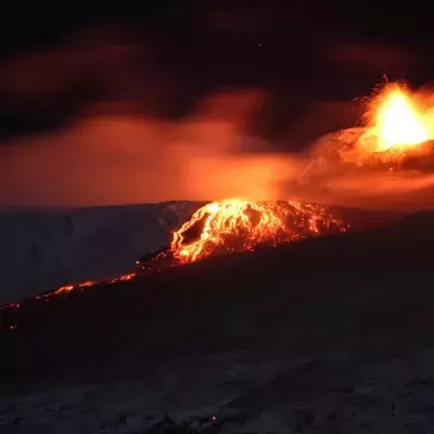 Lava flows and flaming rock rain, images from mount Etna's latest eruption