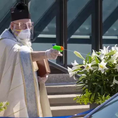 In Detroit, a Priest Is Battling Coronavirus With a Squirt Gun