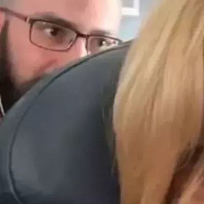 Footage Of American Airlines Passenger Shamed For Repeatedly Pushing Woman's Seat Is Going Viral