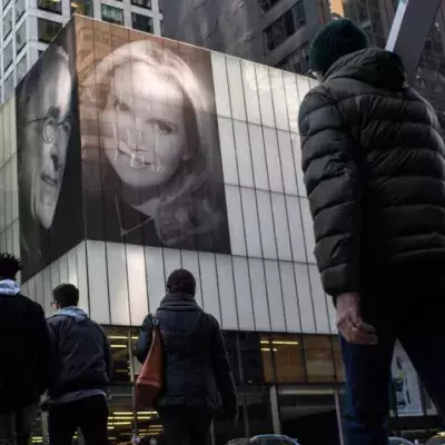 He Hung Pictures Of Himself And His New Wife On A Building To Taunt His Ex