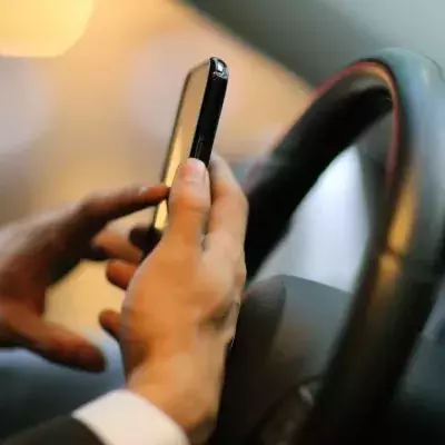 Use of handheld mobile while driving to become illegal next year