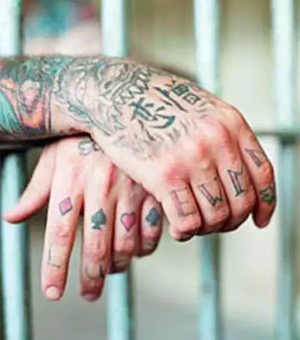 EWMN: this tattoo means “Evil, Wicked, Mean, and Nasty”.
