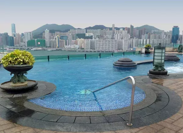 Harbour Plaza Metropolis. This unique pool is located in Hong Kong, China. The pool overlooks the mountains and skyscrappers!