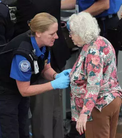 Make eye contact and let grandma know that you need to give her a body search