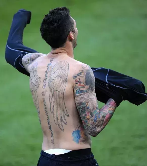 Marco Materazzi got Nike tattoos on his arm. Strange.