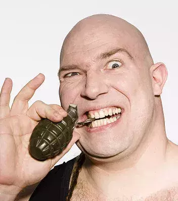 It’s impossible to pull the pin of a grenade with your teeth. All you’d be risking by doing so is a trip to the dentist.